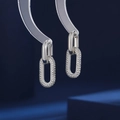 Fashion silver double hoop earrings with paved cubic zirconia on dark blue background - Silver