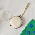 Round cream foldable kids sunglasses storage case with secure zipper and hand strap - Premium Cream White Pouch