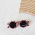 Foldable kids polarized round sunglasses in matte dusty pink finish for girls and boys - Fuschia