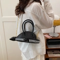 Creative black whale-shaped shoulder bag featuring striped patchwork and golden chain strap - Chain Strap Style / Black