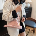 Cute pink dolphin-shaped shoulder bag with gold chain strap and striped base detail - Chain Strap Style / Pink