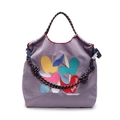 Purple embroidered tote bag with colorful apple patterns and rope-style shoulder strap - Purple