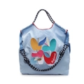 Light blue quilted tote bag with colorful apple embroidery and woven handles - Light Blue