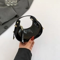 Mini black patent leather crescent bag with glossy finish and gold metal hardware - Black