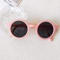 Minimalist round light pink sunglasses for kids with dark black lenses and smooth resin frame - Small Round Frame Pink