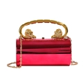 Red acrylic cylindrical clutch bag with golden lion head handles and chain strap - Rose Red