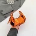 Mini metallic orange hobo bag with glossy finish and gold buckle, shown in hand - Orange