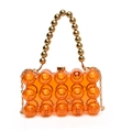 Orange pearl acrylic evening bag with gold bead handle and metallic chain strap - Orange