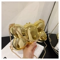Close-up of golden metallic bow-shaped evening bag with a shiny mirror finish and bead chain - Mirror Gold / Pleated Bowknot Style