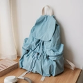 Light blue pleated nylon backpack with drawstring flap and white straps for daily school use - Light Blue