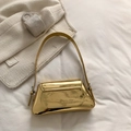 Glossy golden patent leather underarm bag with sleek metallic finish and shoulder strap - Gold