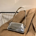 Glossy silver metallic underarm bag with a sleek mirror finish and flap closure - Silver