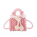 Borsa a mano in perle rosa fatta a mano con fiocco di seta e ciondoli a cuore - Rosa