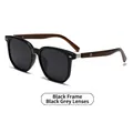 Polarized round sunglasses featuring black frame and brown wood grain temples - Black Frame Black Grey Lens