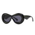 Futuristic inflated black oversized sunglasses with thick glossy frames and dark grey lenses - Black