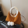 Brown faux suede trapezoid handbag with white fluffy faux fur trim and pom-pom charms - Brown