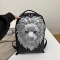 Black leather backpack featuring a 3D silver lion head relief and punk style metal studs - Silver