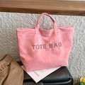Pink suede tote bag with black studded text detail and spacious double top handles - Pink