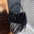Bohemian black suede shoulder bag with long fringes and golden hardware on white fabric - Black