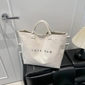 Minimalist beige large capacity suede tote bag with TOTE BAG print for daily commute - White