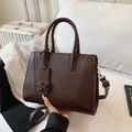 Dark brown matte leather handbag with geometric stitching and detachable shoulder strap - Brown