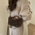 Dark brown faux shearling crossbody bag with leather trim and round metal buckle detail - Coffee