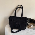 Versatile black corduroy tote bag with multiple pockets and adjustable shoulder strap - Black