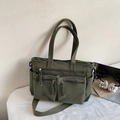 Olive green corduroy tote bag with dual front pockets and adjustable shoulder strap - Green