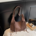 Brown suede hobo bag with fringe details and wide shoulder strap in bohemian style - Brown