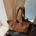 Vintage brown leather tote bag with silver metal grommets and adjustable shoulder strap - Coffee