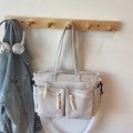 Light gray corduroy tote bag with large zipper pockets and adjustable shoulder strap - Off-white