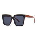Modern oversized cat-eye sunglasses with black frame, gold trim and brick red temples - Red/Black Grey (C5)