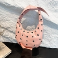 Pink patent leather crescent hobo bag with silver metallic eyelets and knotted strap - Pink