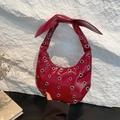 Deep red patent leather crescent hobo bag with oversized bow and silver grommet studs - Red
