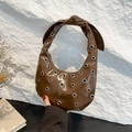 Dark brown crescent tote bag with metallic eyelets and stylish knotted handle - Brown