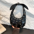 Black patent leather hobo bag with silver rivets and bow detail on the shoulder strap - Black