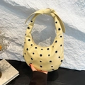 Creamy yellow crescent bag with silver rivet studs and stylish knotted strap design - Yellow