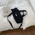 Large black nylon travel duffel bag with Chic Craze label on white background - Black