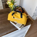 Large capacity yellow nylon travel tote bag with blue handles for sports and fitness - Yellow