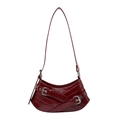 Deep red patent leather crescent shoulder bag with silver buckles in biker style - Burgundy