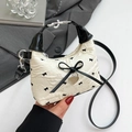 Mini off-white floral crossbody bag with black bow print and heart charm detail - White