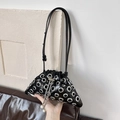Black punk style triangle bucket bag with silver metal eyelets and pearl charm - Black