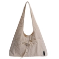 Beige oversized tote bag in crinkled nylon fabric with decorative buckles and pockets - Off-white