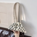 Fashionable cream rivet bucket bag with silver eyelets and pearl drawstring detail - White