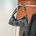 Retro black patent leather crescent hobo bag with glossy finish and silver metal buckle strap - Black