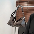 Brown patent leather crescent shoulder bag with silver rivet straps and vintage texture - Brown