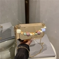 Octagonal gold metal box bag with colorful macabre beaded handle and chain strap - Gold