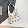 White bucket shoulder bag with silver metal studs and chic minimalist gothic style - White