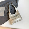 Silver metallic shoulder bag featuring all-over punk rivets and a modern gothic design - Silver