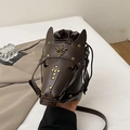 Deep brown horse head bucket bag with vintage fleur-de-lis metal studs and shoulder strap - Brown